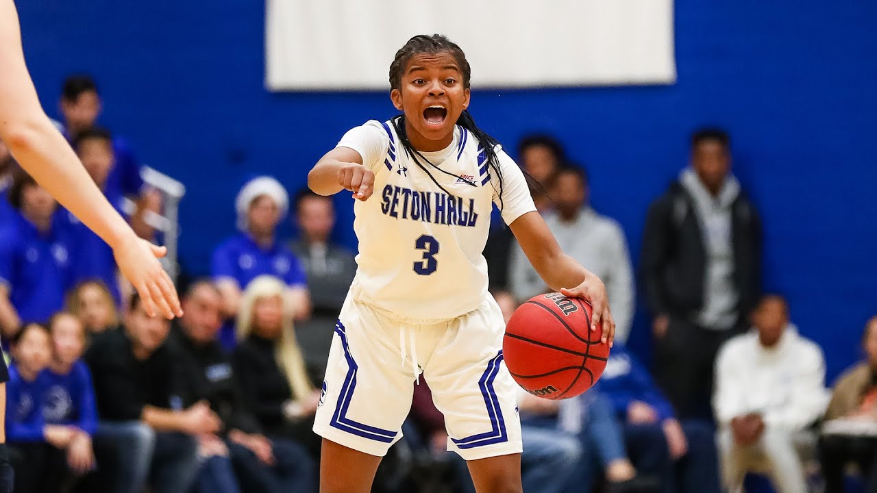 Lauren Park-Lane in Seton Hall jersey directing the offense during a college basketball game.