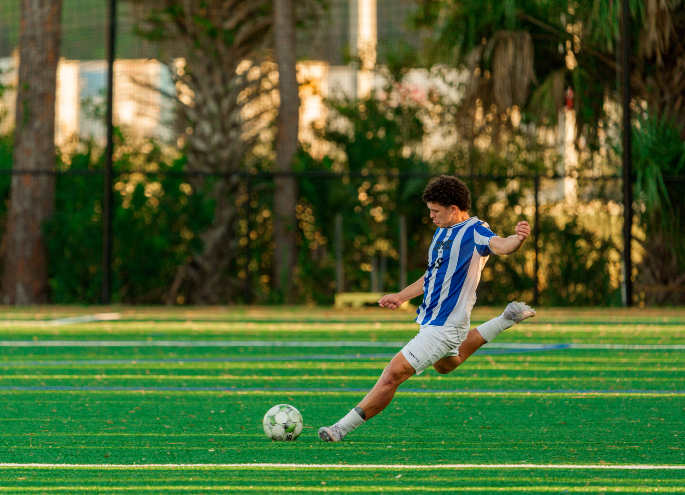 soccer player attempting a kick