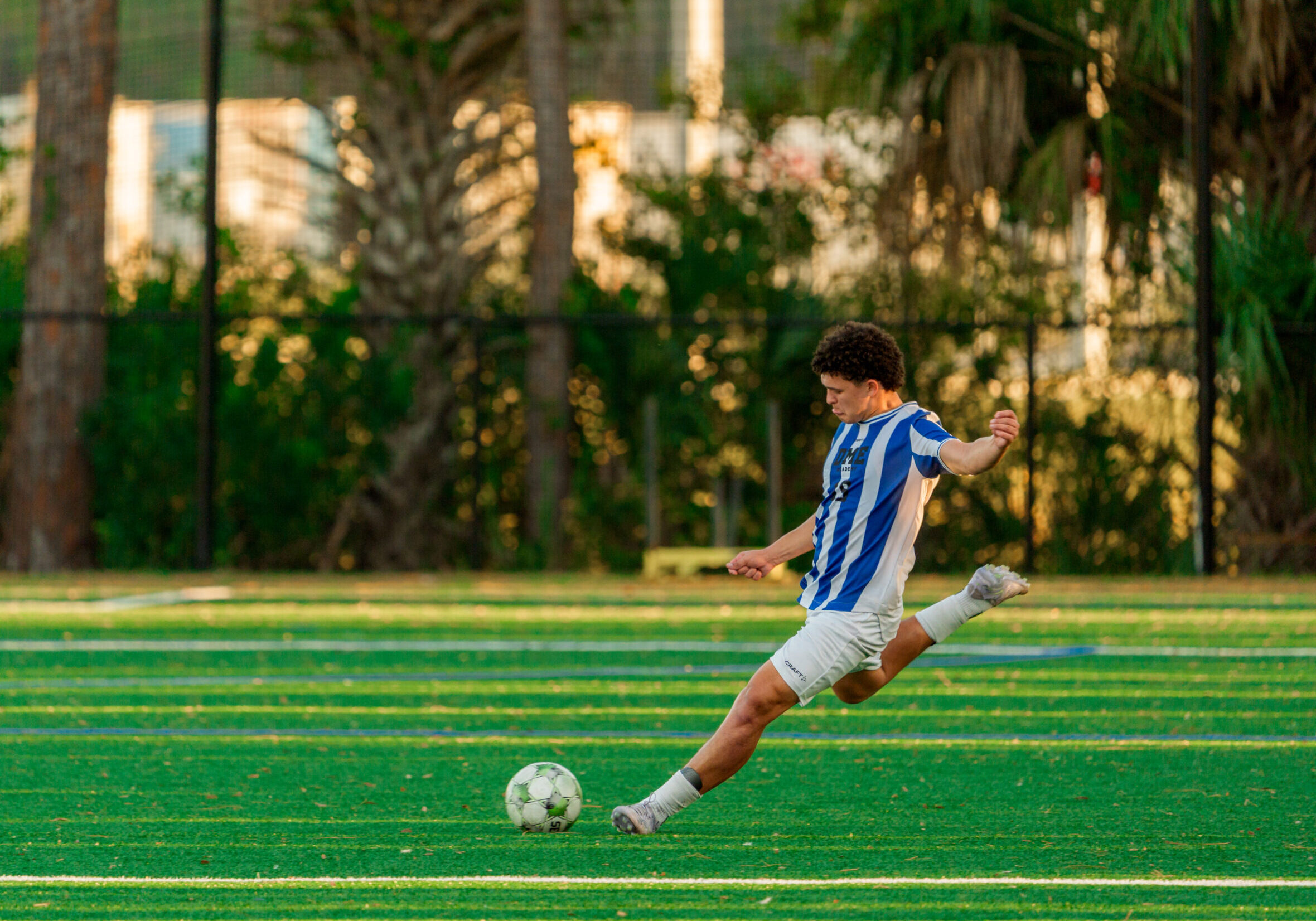 soccer player attempting a kick