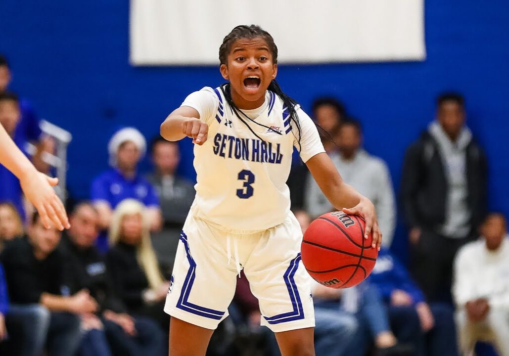 Lauren Park-Lane in Seton Hall jersey directing the offense during a college basketball game.